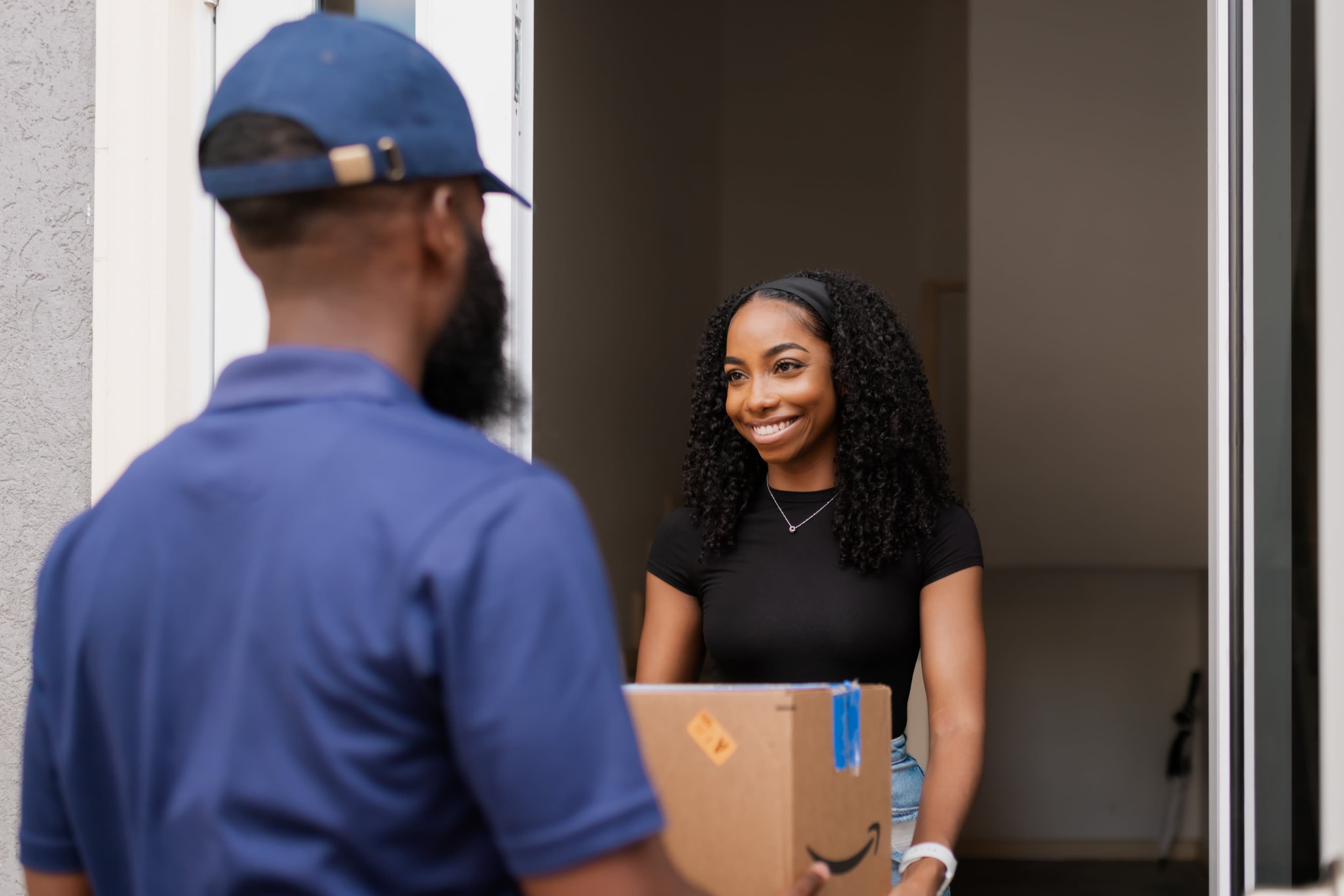 Customer receiving a package at their door